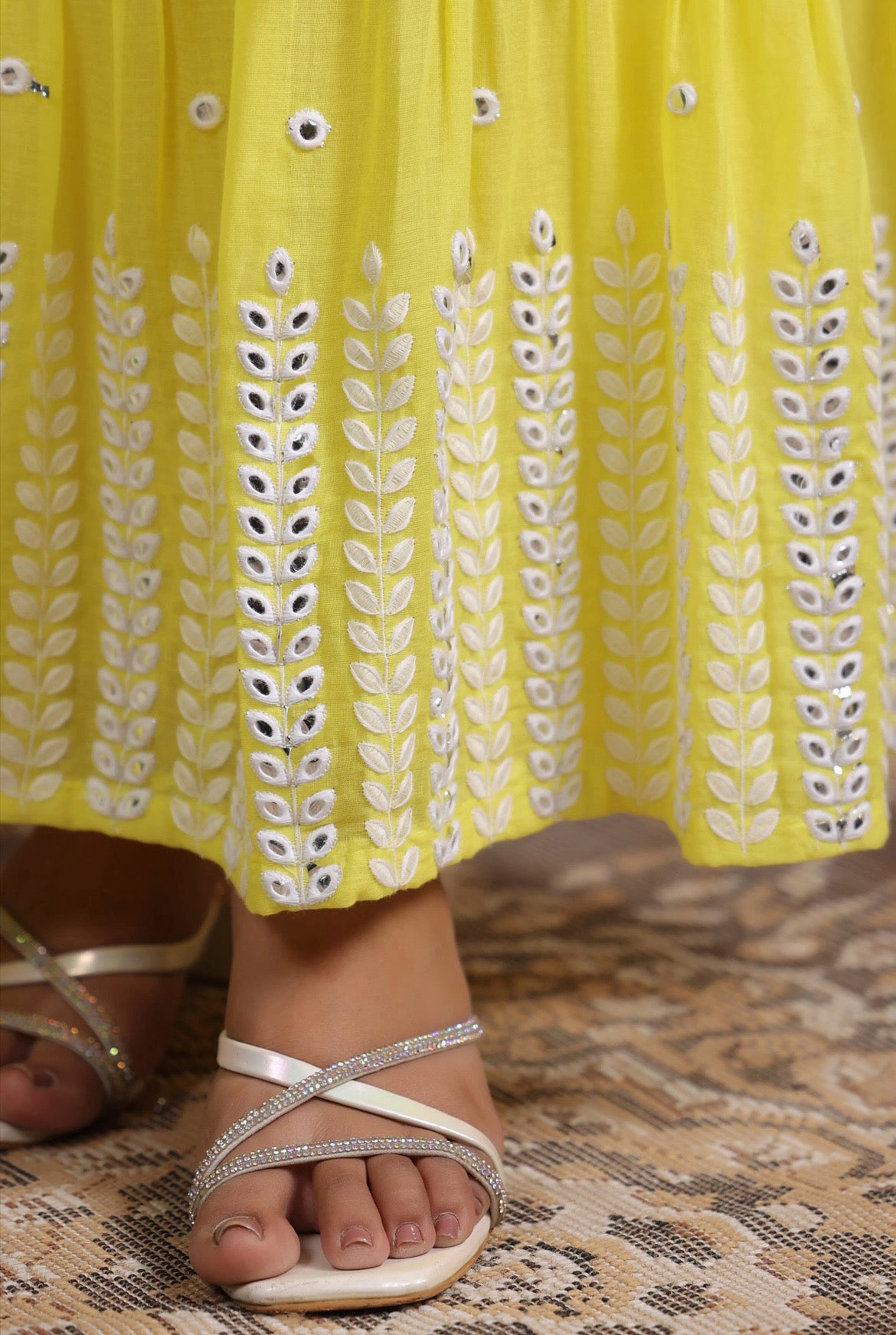 Anarkali dress, anarkali gown. Angrakha style. Yellow colour. Detail view.