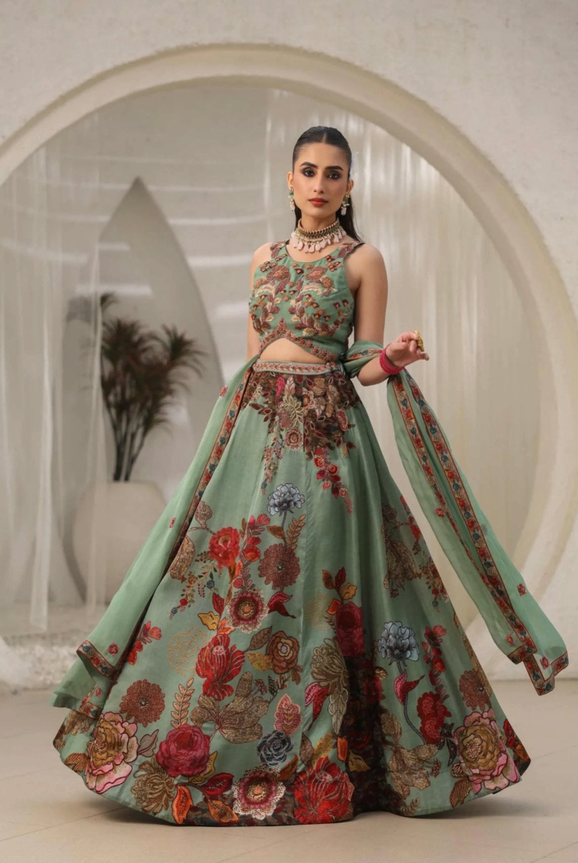 Lehenga choli for women in best price made with organza fabric and embellished with hand work. It’s printed with delicate hand embroidery best for wedding lehenga. Front Twirl View.