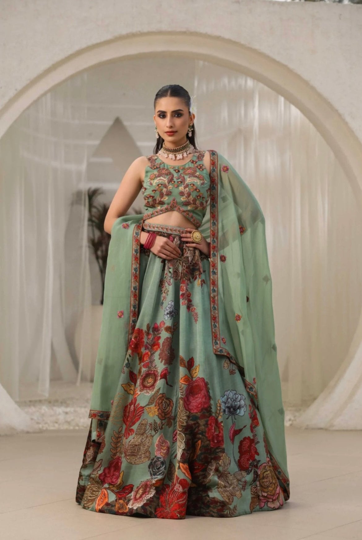 Lehenga choli for women in best price made with organza fabric and embellished with hand work. It’s printed with delicate hand embroidery best for wedding lehenga. Front View.