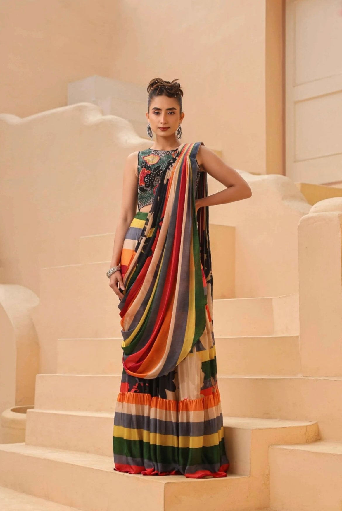 Drape saree, ready to wear. Made in luxurious satin georgette and organza fabric. Multicolour printed with hand embroidery blouse. Front View.