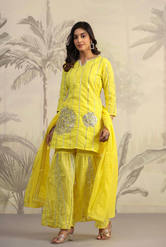 Women cotton kurta pant outfit, Gota work, Yellow colour, mulmul suit. Front view.