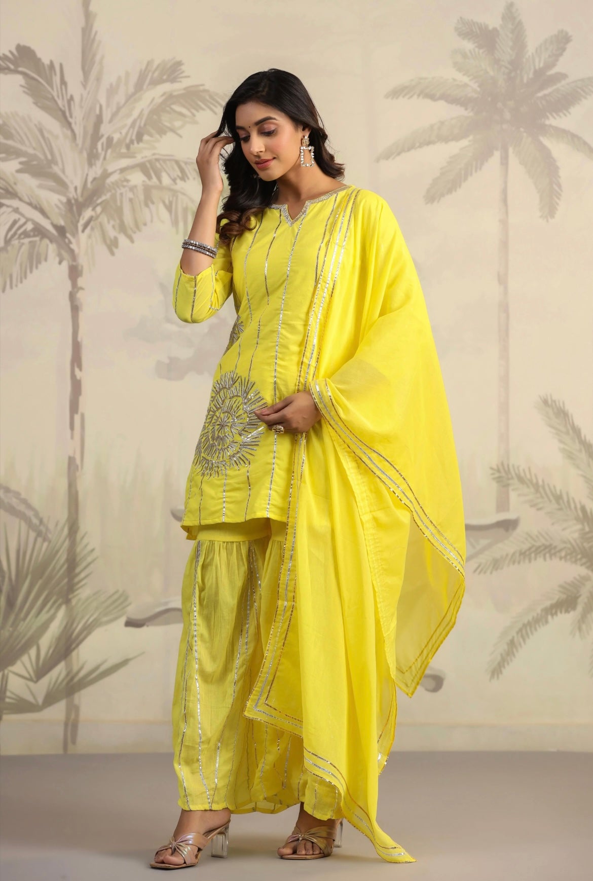 Women cotton kurta pant outfit, Gota work, Yellow colour, mulmul suit. Side view.