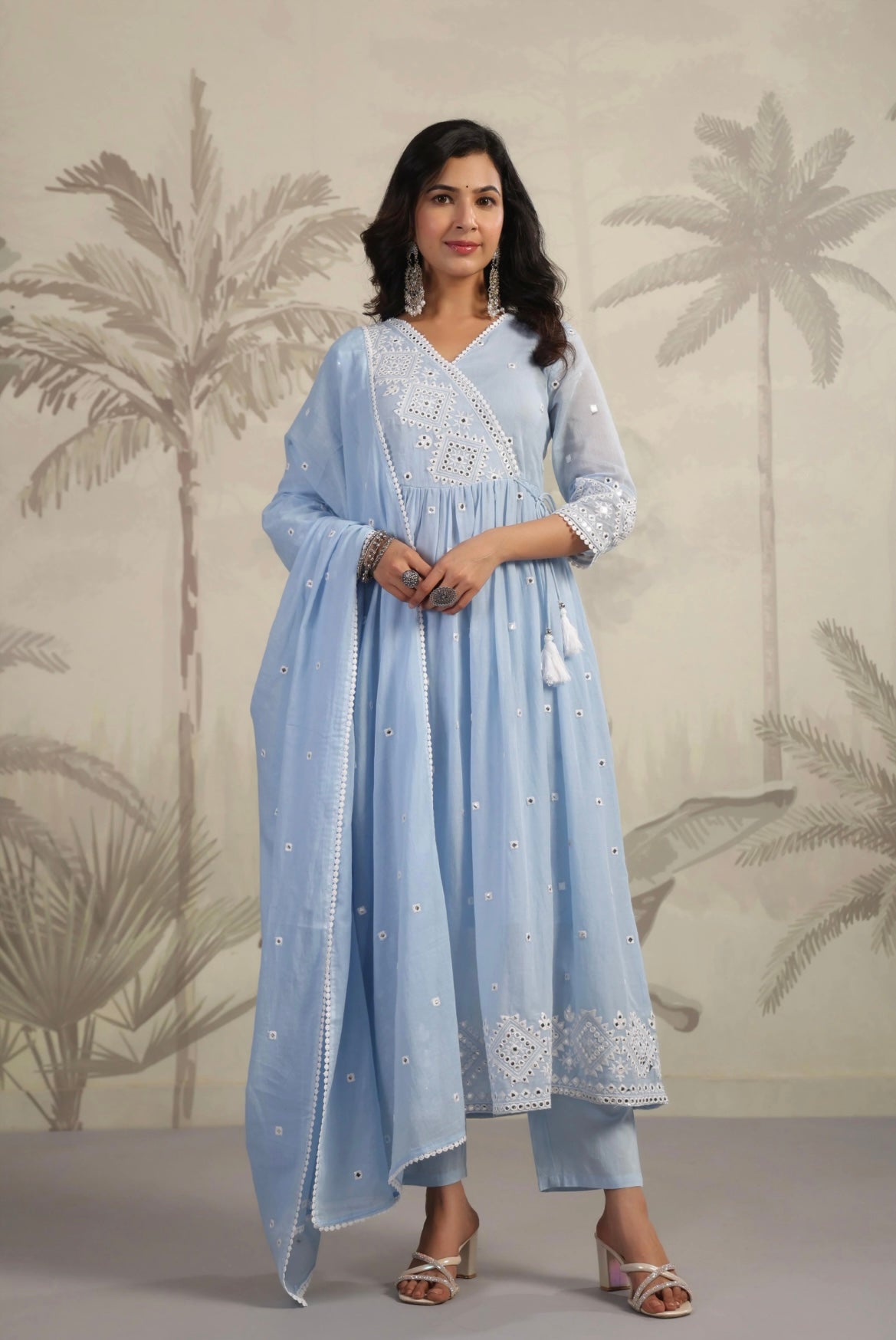 Anarkali suit for women in softest cotton fabric. It’s pastel blue in colour with mirror work. Front View.