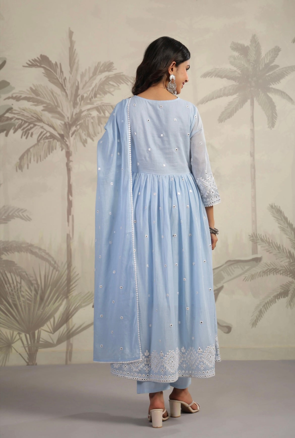 Anarkali suit for women in softest cotton fabric. It’s pastel blue in colour with mirror work. Back View.