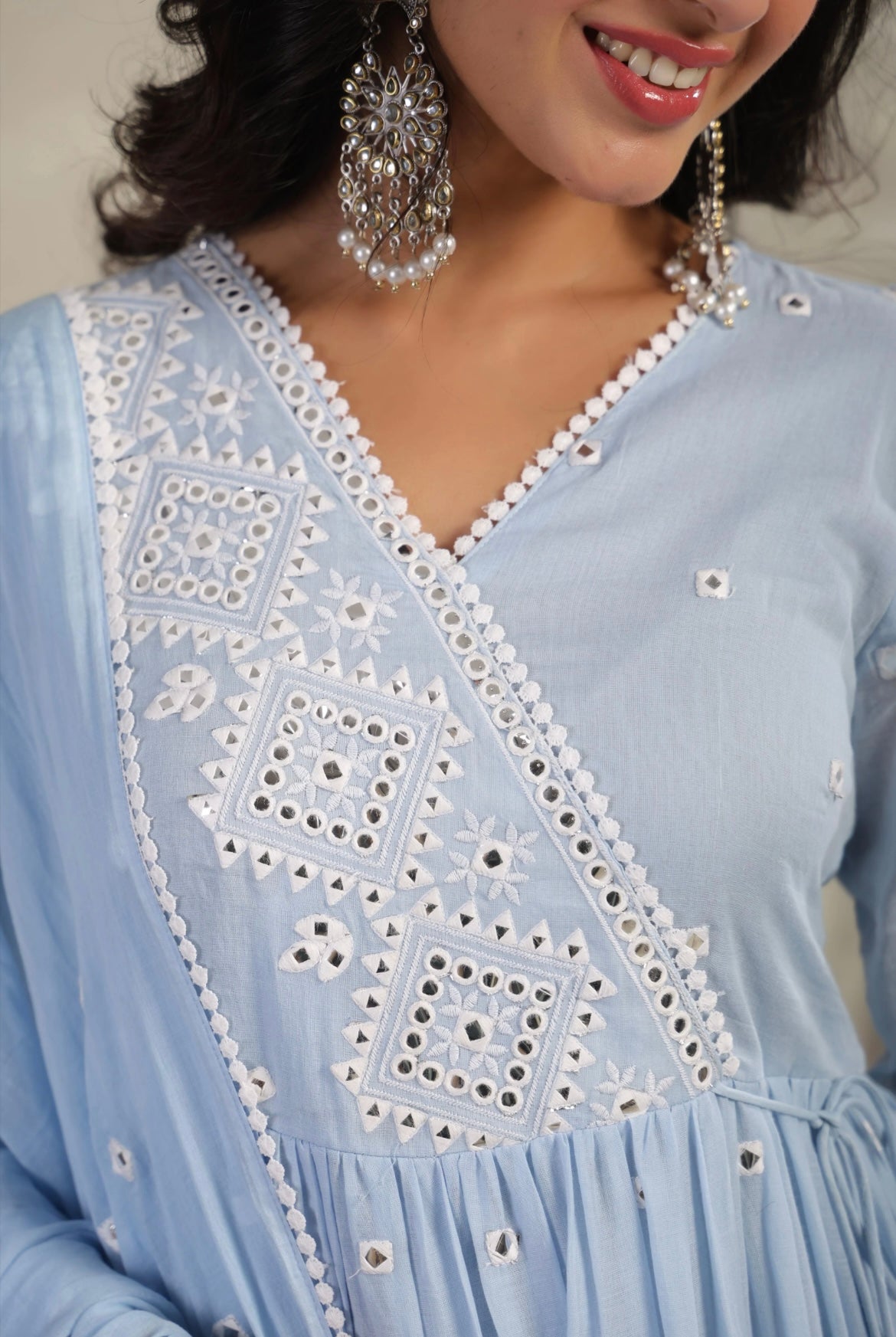 Anarkali suit for women in softest cotton fabric. It’s pastel blue in colour with mirror work. Detail View.