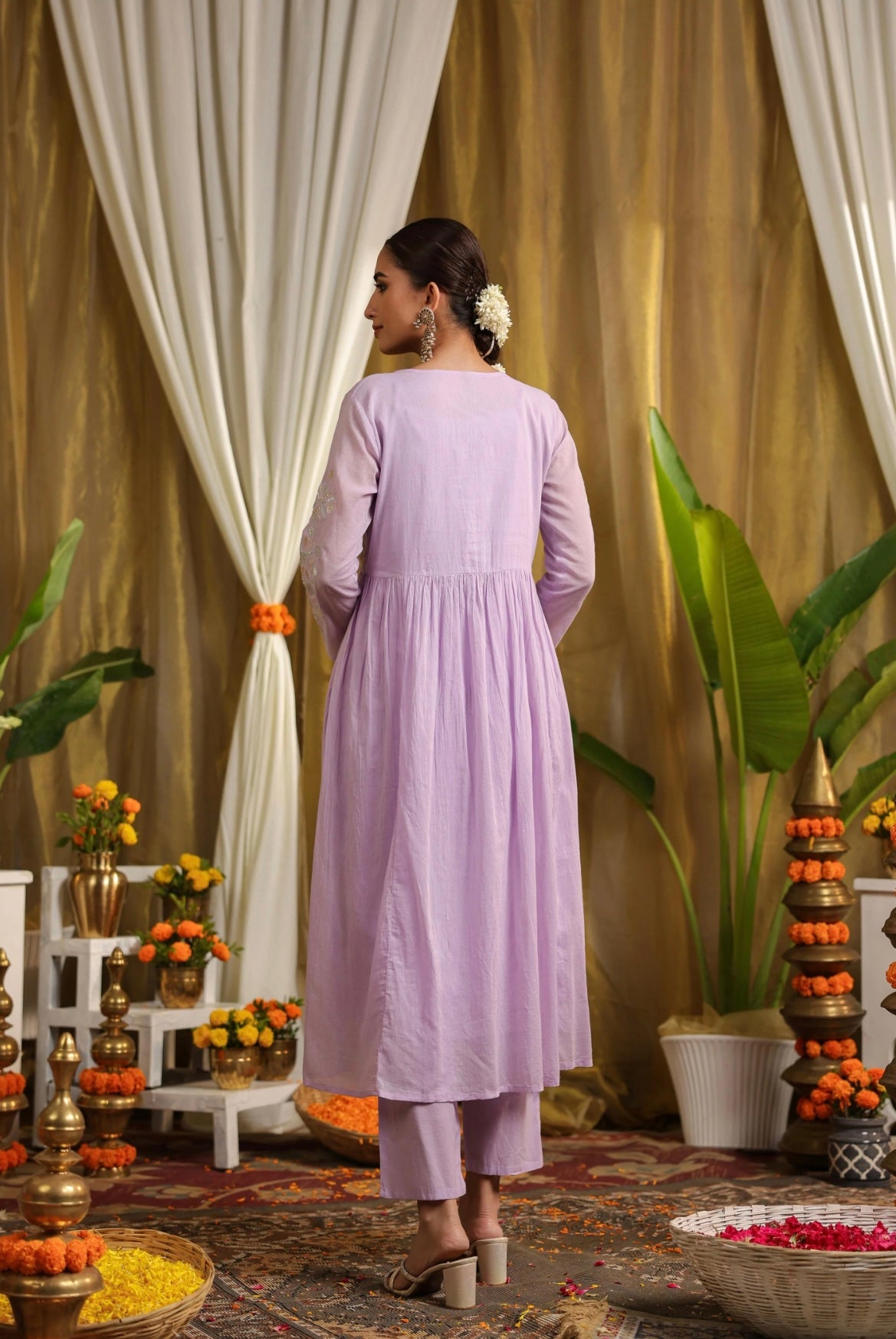 Indo western dress with shrug made in mulmul cotton embroidered with Gota work. Lavender colour with beautiful tassels. Back view.