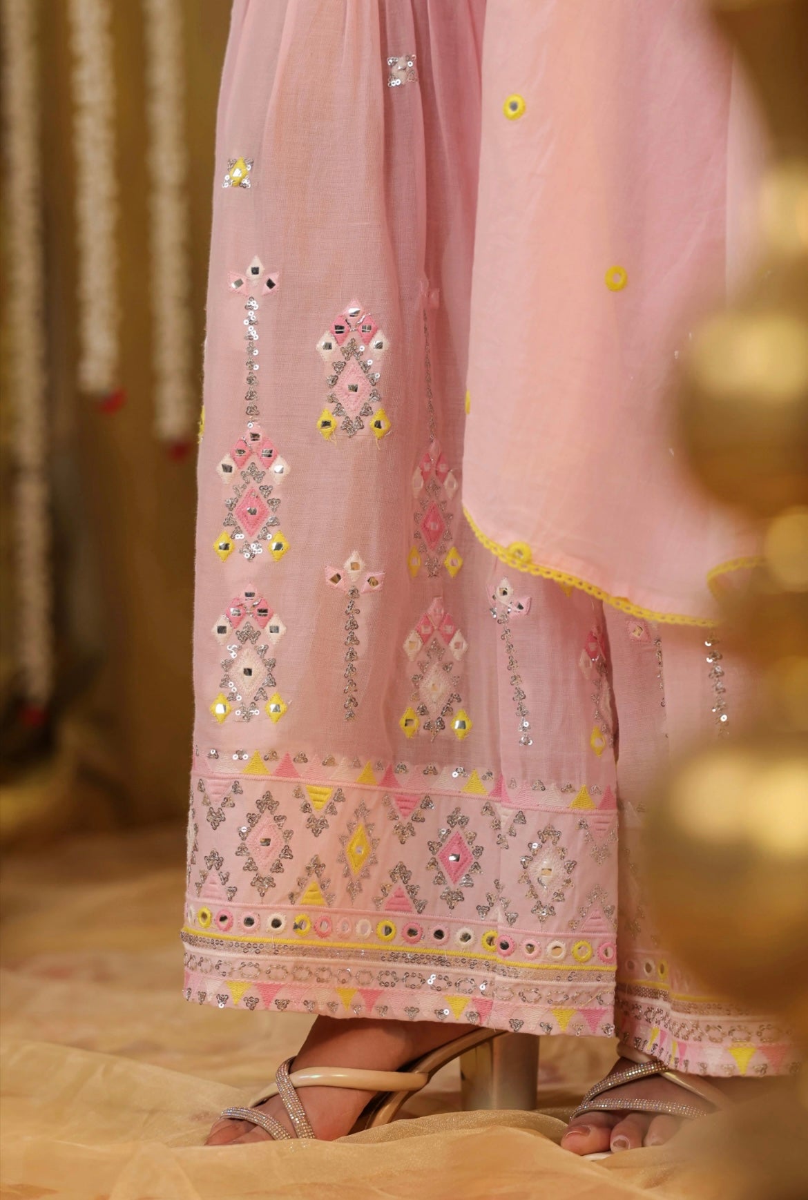 Cotton kurta peplum style in Baby Pink colour with sequins embroidery and intricate contrast yellow thread work. Accompanied by sharara pants. Detailed embroidery zoomed view.