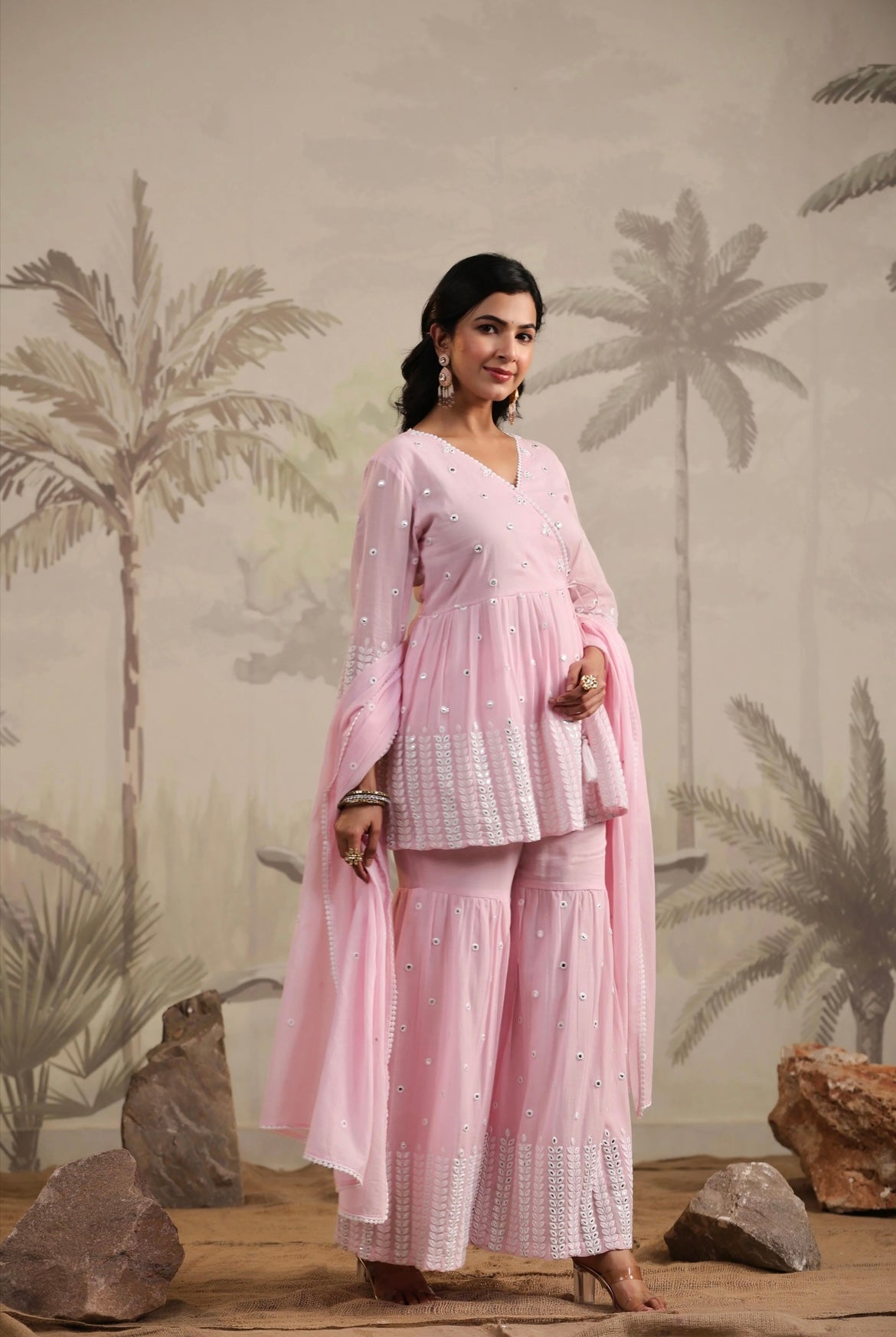 Sharara woman, Sharara suit,baby pink colour, peplum kurta, mirror work, Side View.