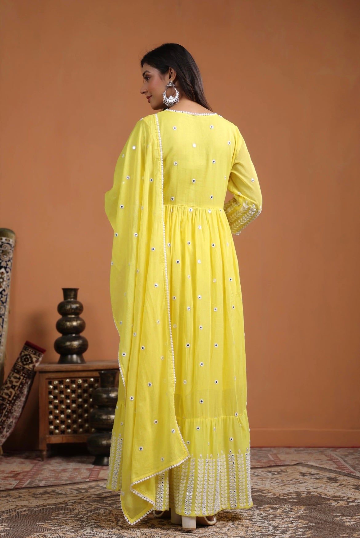 Anarkali dress, anarkali gown. Angrakha style. Yellow colour. Back view.