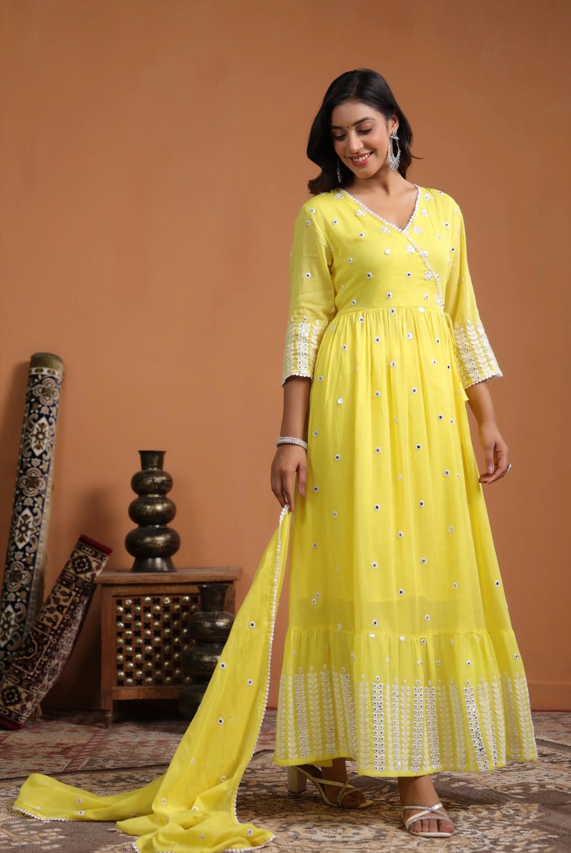 Anarkali dress, anarkali gown. Angrakha style. Yellow colour. Front view.