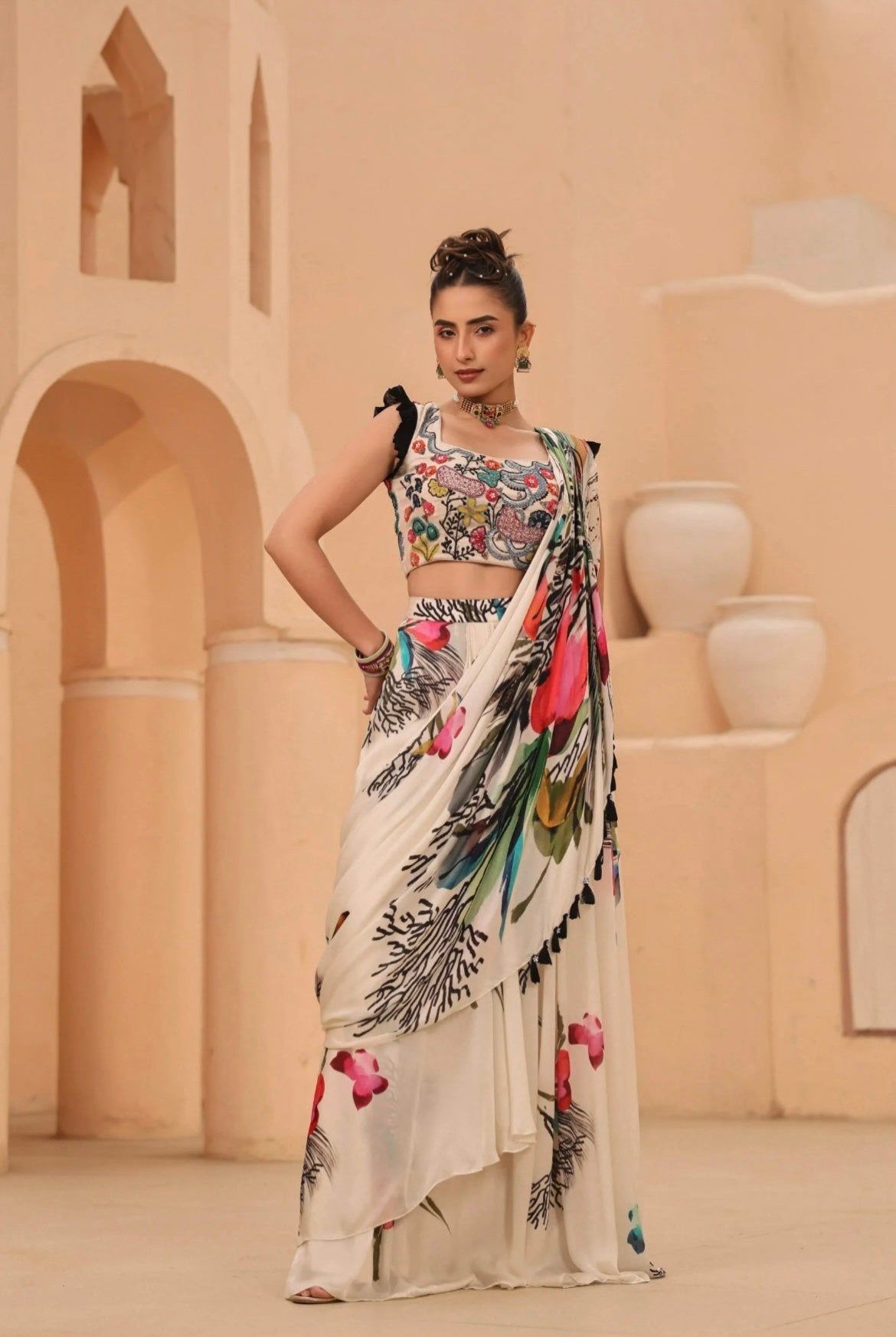 Drape saree ready to wear, white with floral abstract print comes with fully hand embroidered blouse. Front View.