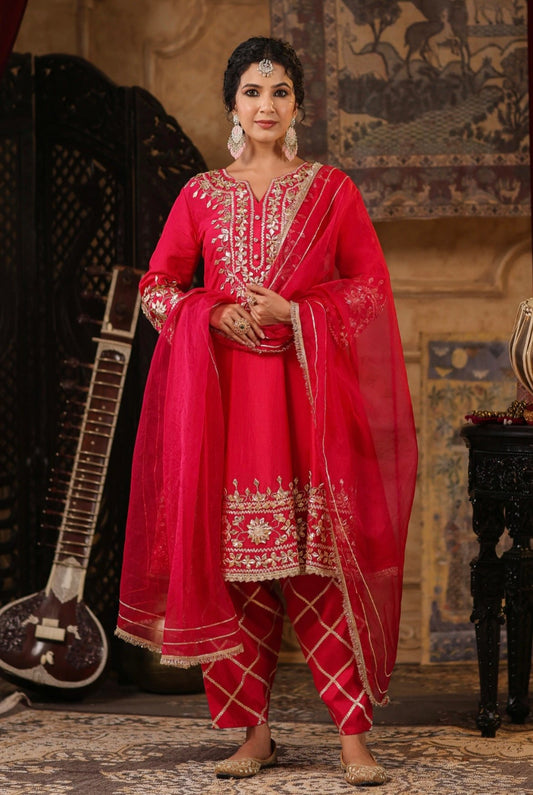 Fuchsia Anarkali Salwar set with Gota patti work. Front view.