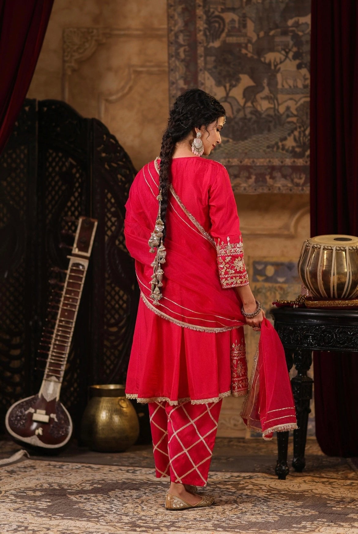 Fuchsia Anarkali Salwar set with Gota patti work. Back view.