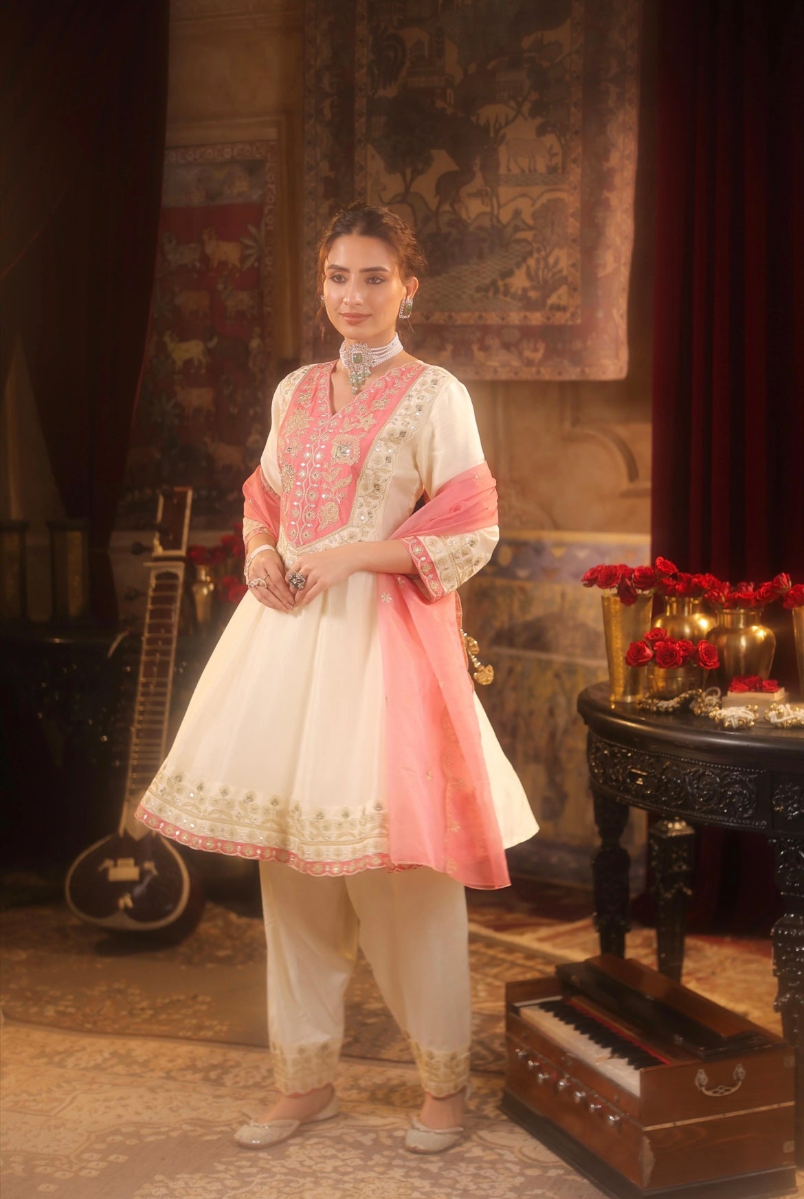 Ivory Silk Dori Embroidery Anarkali with Rose Pink Organza Dupatta. Side view.