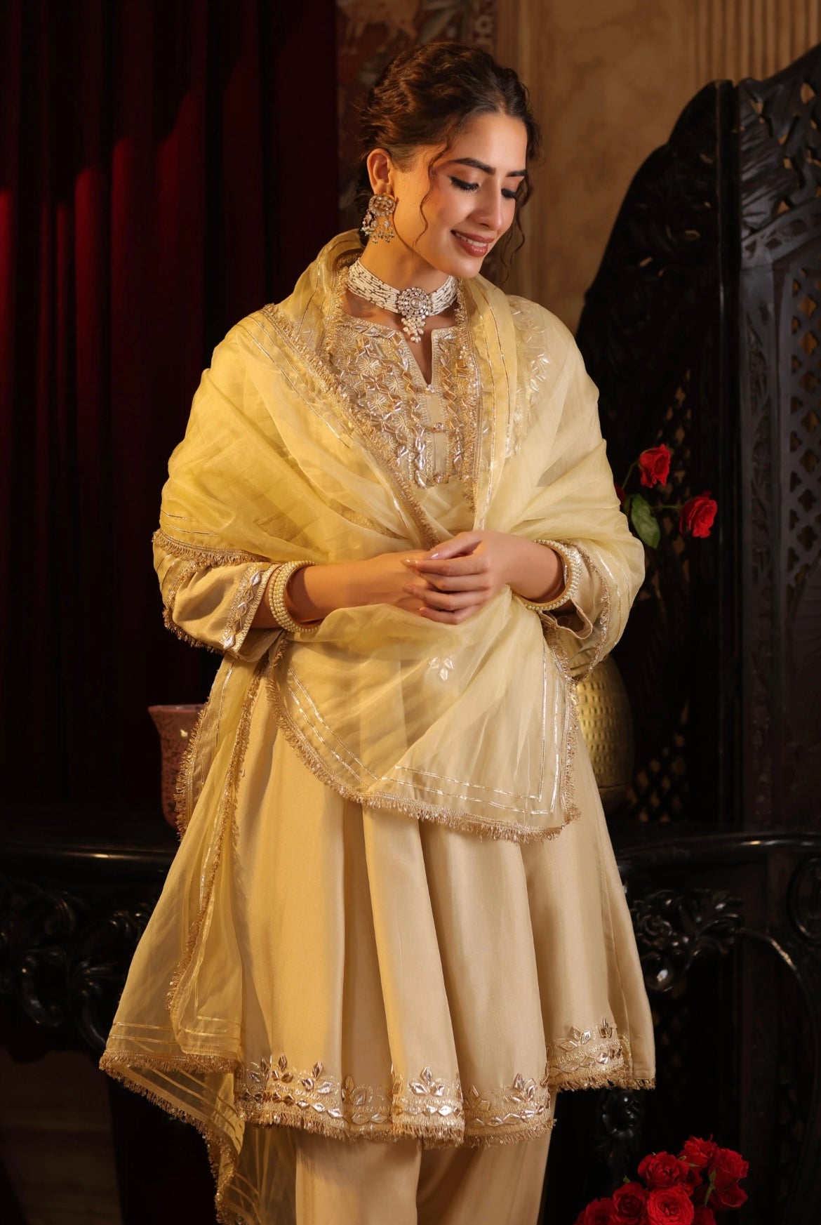 Beige gold Silk Gota Embroidery Anarkali set with Salwar and Organza Dupatta. Side view.