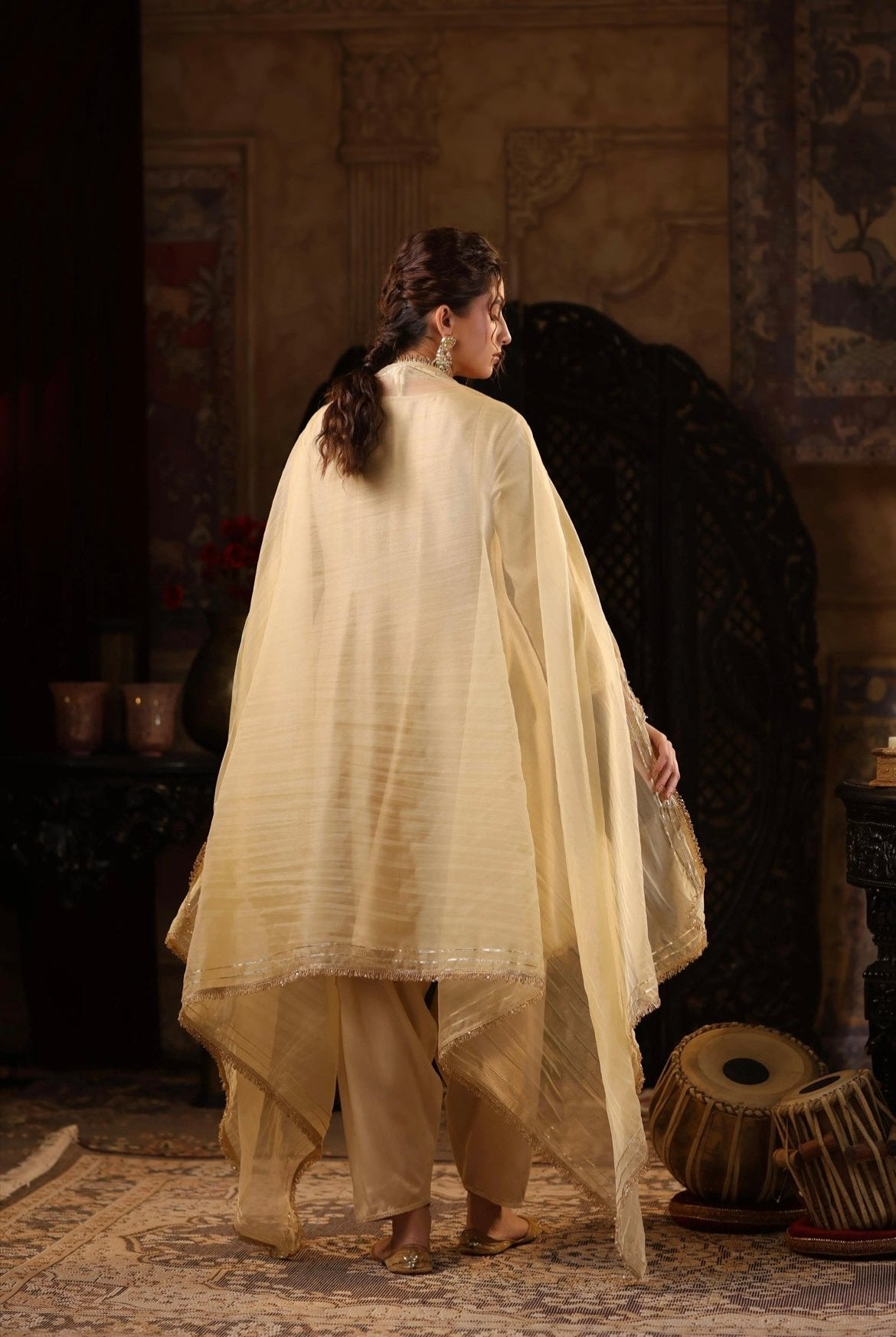 Beige gold Silk Gota Embroidery Anarkali set with Salwar and Organza Dupatta. Back view.