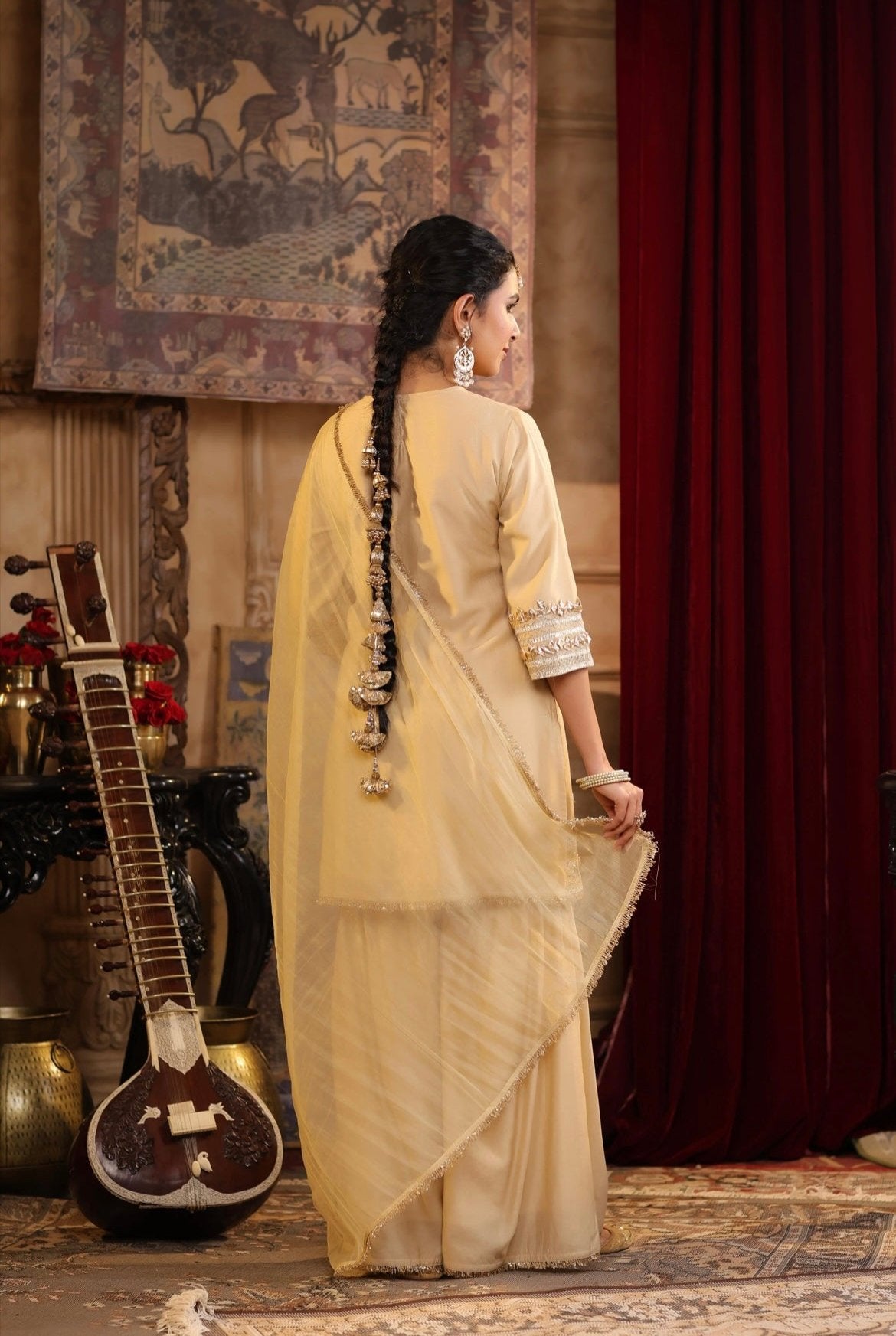 Beige Chanderi Silk Kurta Sharara Set with gota and Dori embroidery. Back view.