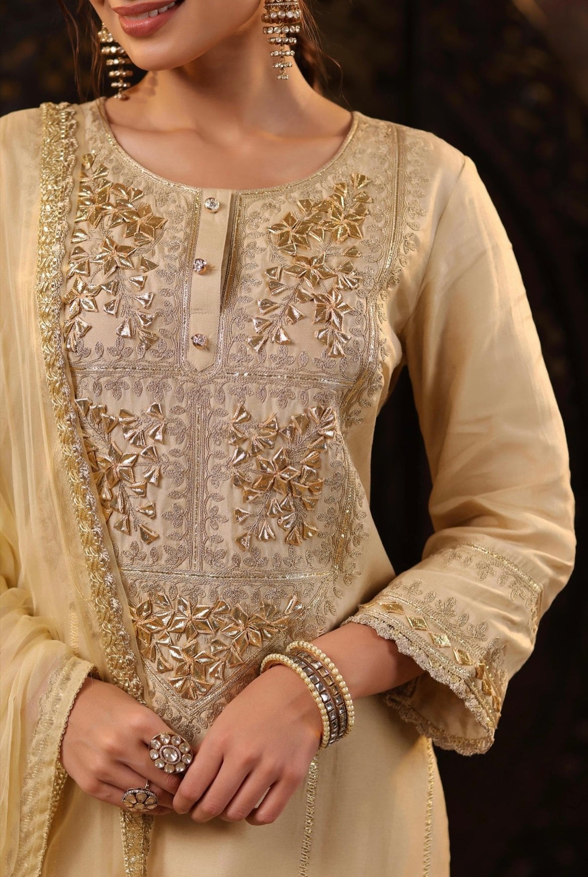 Beige Silk Kurta Pant set with gota and Dori embroidery. Detail embroidery view.