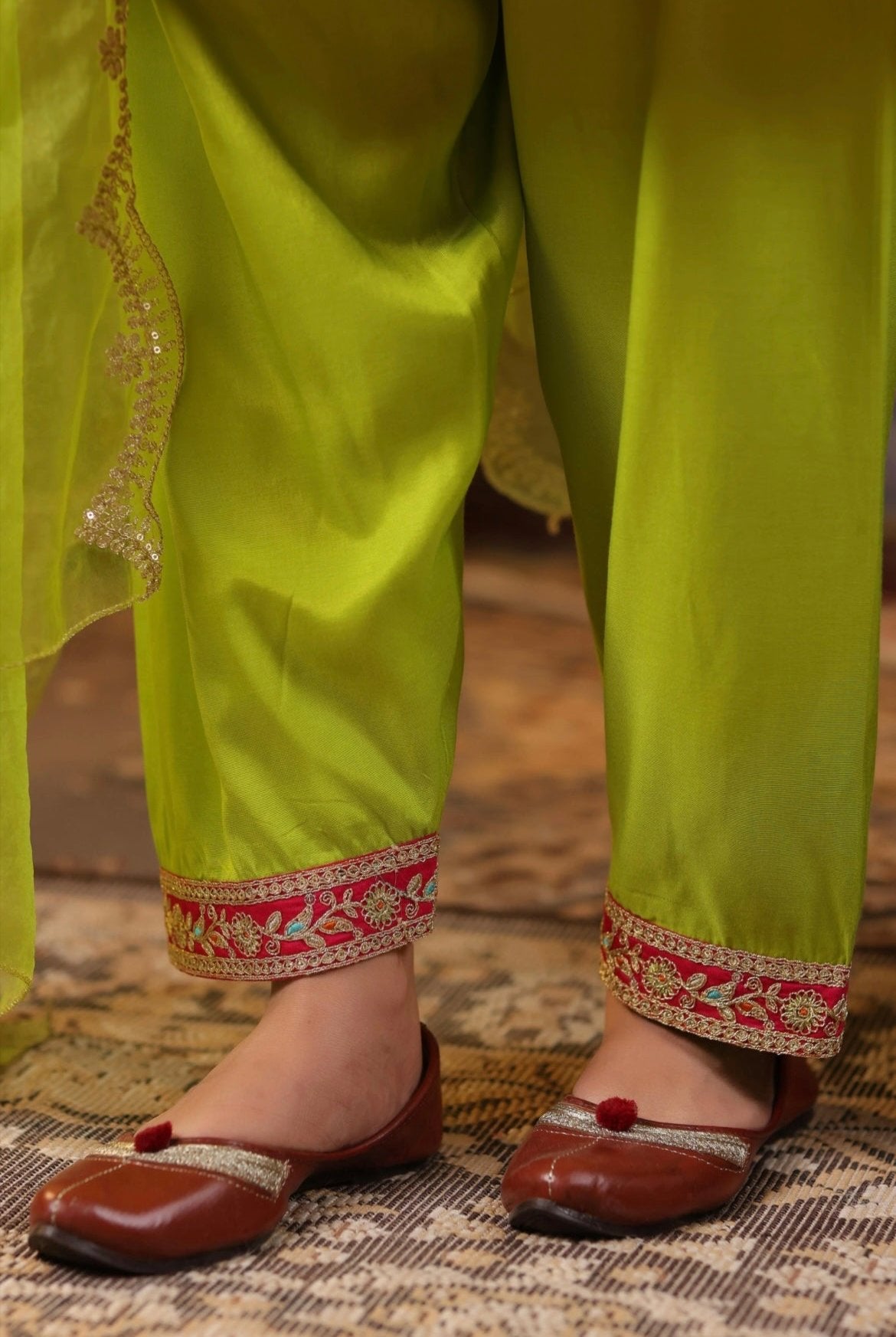 Fuchsia Lime Green Silk Anarkali Set with Zari and Dori embroidery. Salwar detail view.