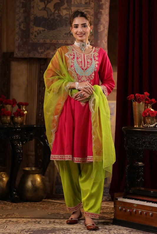 Fuchsia Lime Green Silk Anarkali Set with Zari and Dori embroidery. Front view.