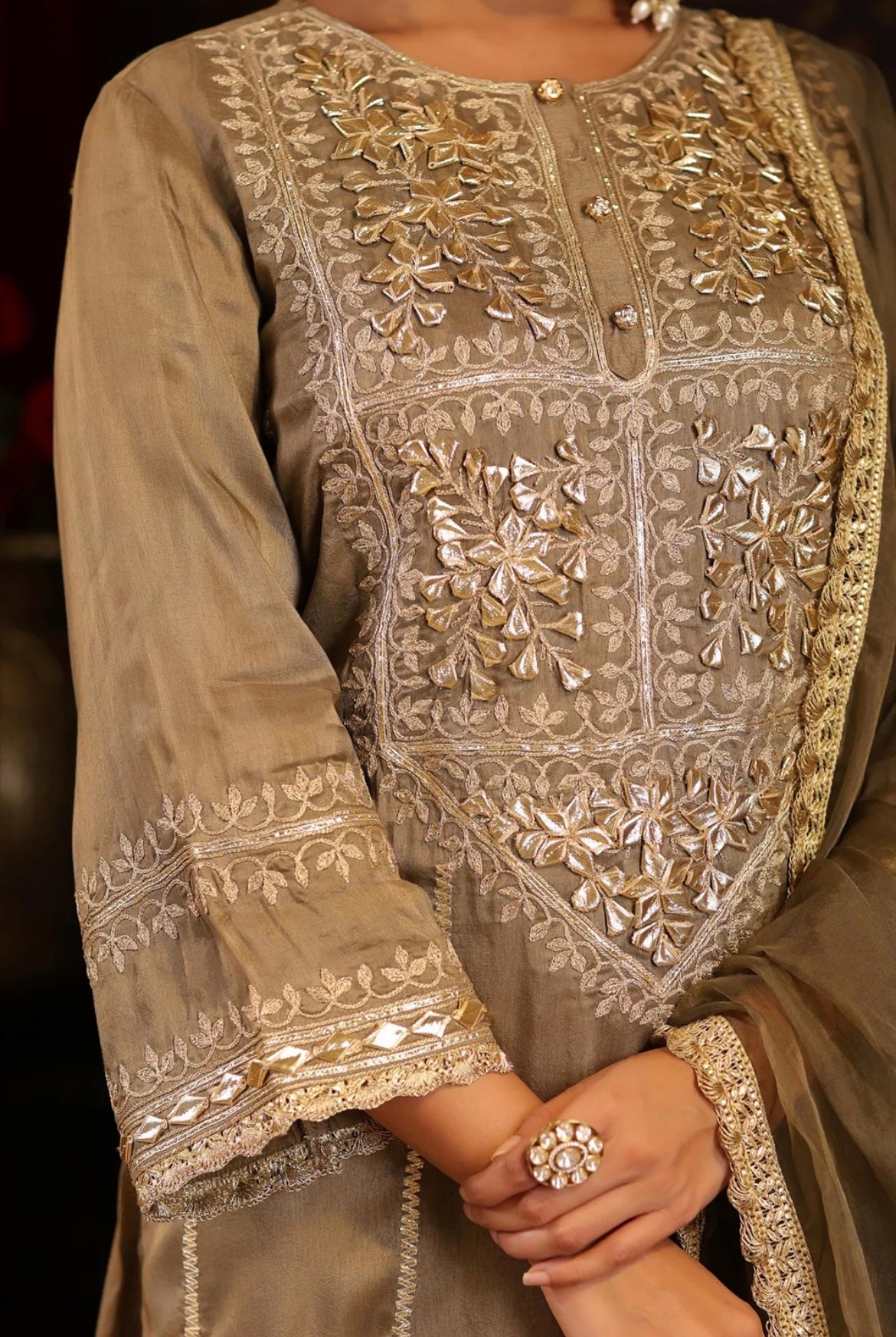 Taupe Silk Kurta Pant Set with zari and gota patti embroidery. Detail view.