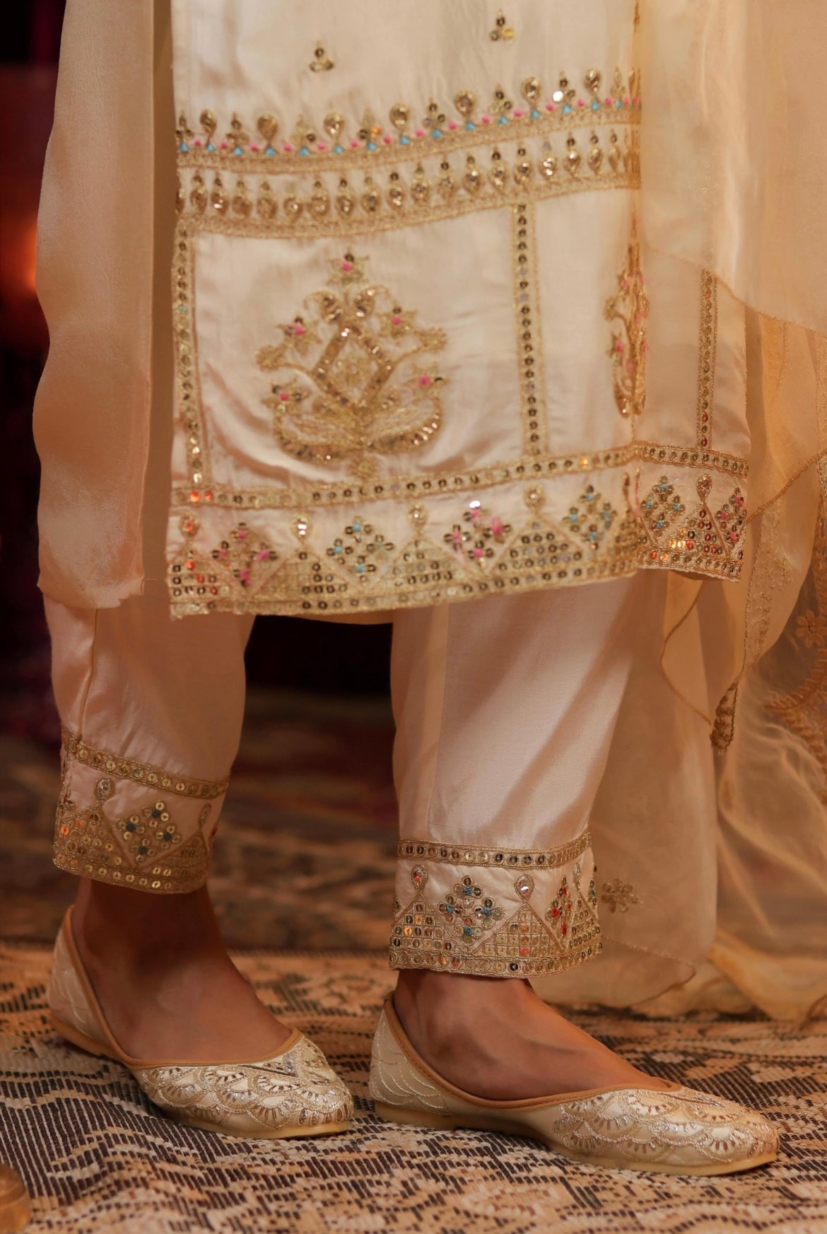 Ivory Silk Kurta Suit Set with Dori Embroidery. Detail view bottom.