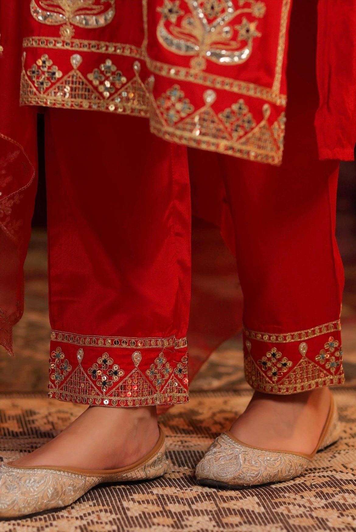 Red Silk Kurta Pant set with dori sequin embroidery. Bottom detail view.