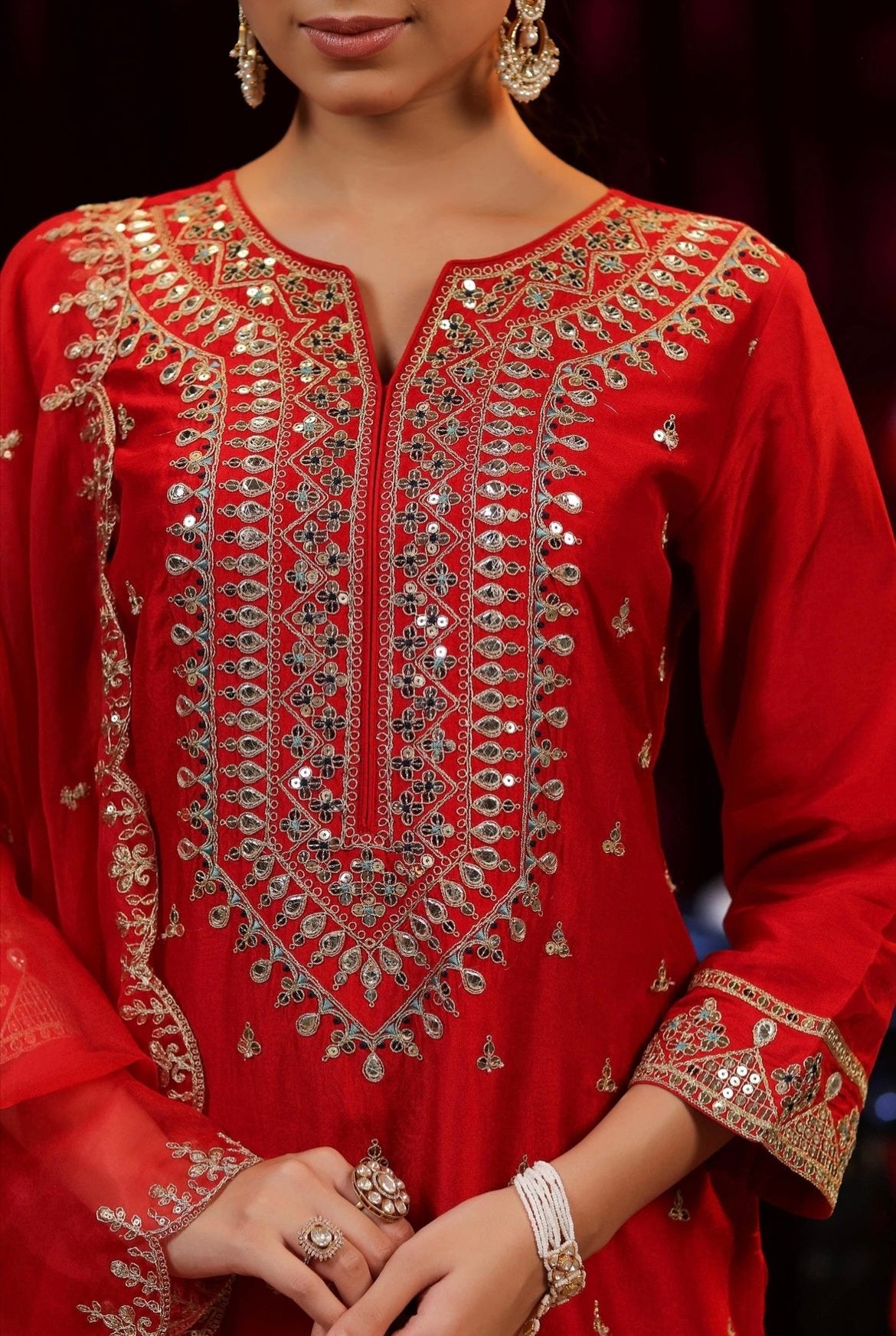 Red Silk Kurta Pant set with dori sequin embroidery. Detail view.