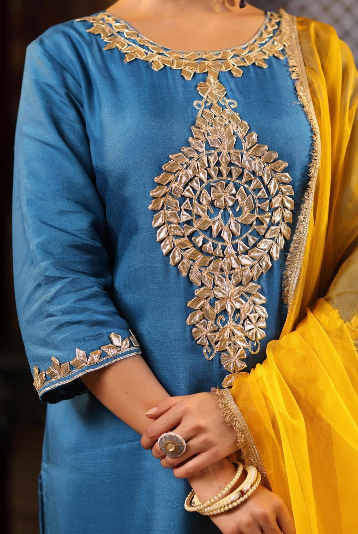 Teal Blue Silk Kurta with Mustard Organza Dupatta Set. Gota Patti embroidery. Detail view.